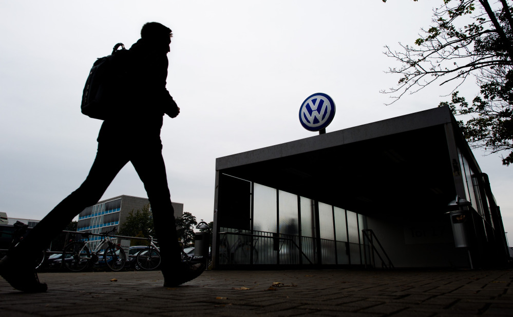 A VW employee enters the Volkswagen factory site through Gate 17 in Wolfsburg, Germany.