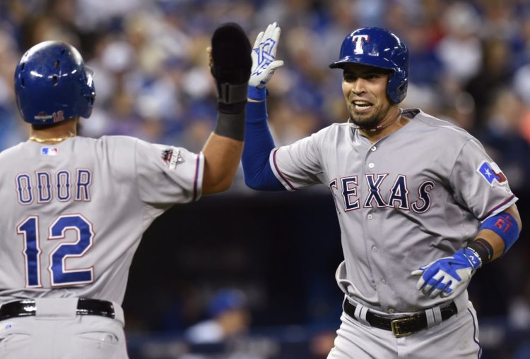 The Rangers’ Robinson Chirinos, right, is congratulated by teammate Rougned Odor on his two-run home run, which gave Texas a 4-1 lead in the top of the fifth inning of Game 1 of the American League Division Series.
