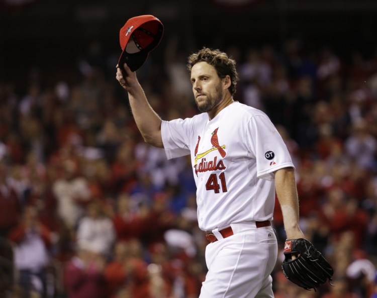 John Lackey tips his cap to the crowd after being taken out during the eighth inning of Friday night’s National League Division Series opener against the Chicago Cubs. Lackey didn’t give up a hit until the sixth inning.
