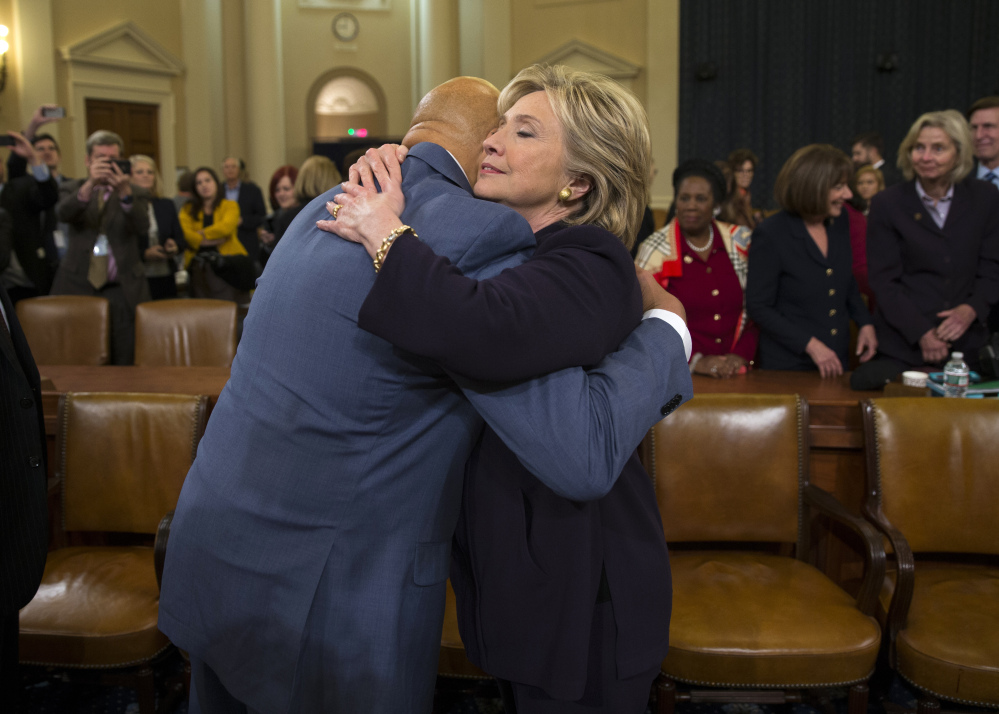 Hillary Clinton hugs Rep. Elijah Cummings, D-Md., after her testimony. Democrats accused Republicans of using the committee to try to damage her candidacy for president.