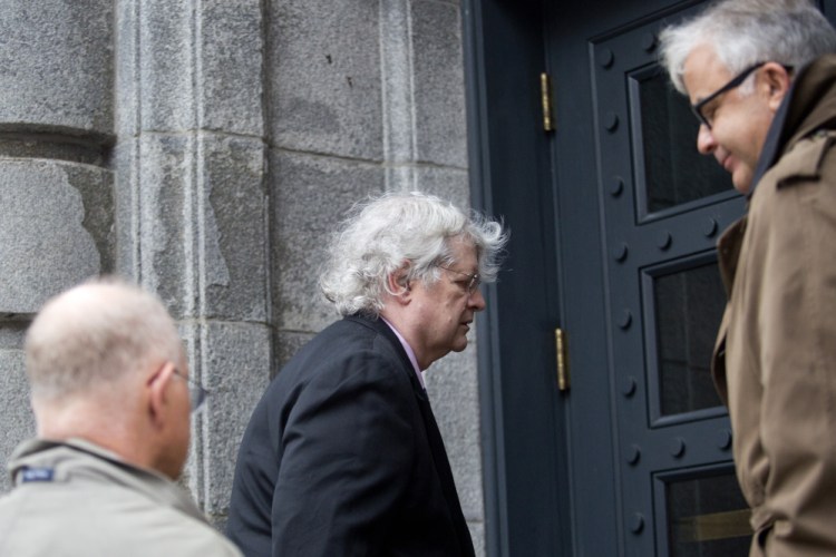 Dr. Joel Sabean, a prominent dermatologist from Falmouth, enters court in October 2015 with attorneys Jay McCloskey and Thimi R. Mina. Sabean was back in court Tuesday for the start of his trial on charges of tax evasion, illegally distributing controlled substances and health care fraud.
