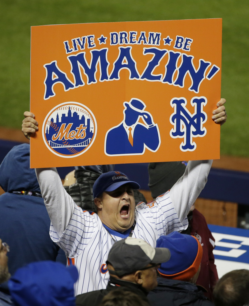 New York fans cheer the Mets in the sixth inning of Game 3. (AP Photo/Frank Franklin II)