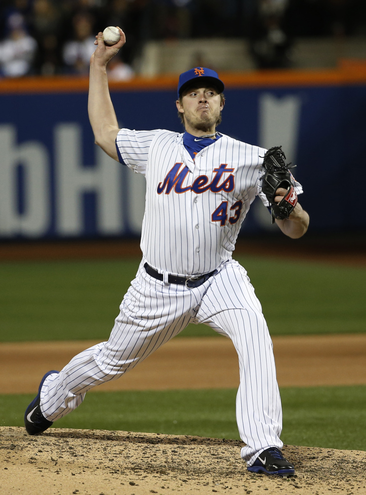 The Mets' Addison Reed pitches to the Royals in the seventh inning. (AP Photo/Matt Slocum)