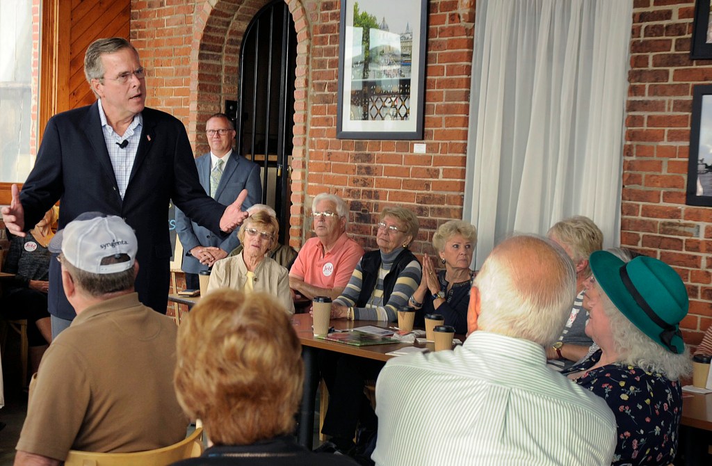 Former Florida Governor and Republican presidential candidate Jeb Bush answers questions during a meet and greet Wednesday, at Elly's Tea and Coffee in Muscatine, Iowa. Beth Van Zandt/Muscatine Journal via AP