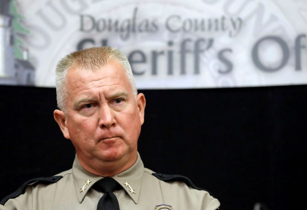 Douglas County Sheriff John Hanlin listens to  a reporter's question during a news conference on Oct. 2 in Roseburg, Ore. Hanlin has become a symbol of the region's rejection of tighter gun control. The Associated Press