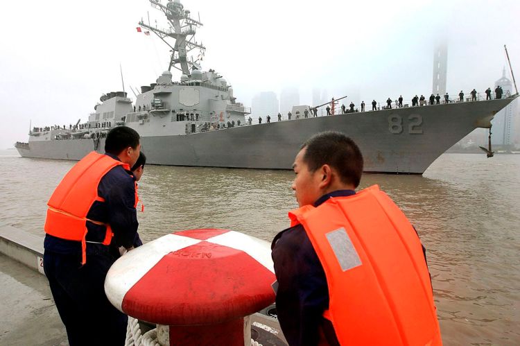 Chinese navy personnel get ready for U.S. Navy guided missile destroyer USS Lassen to dock at the Shanghai International Passenger Quay for a scheduled port visit in this 2008 photo. The USS Lassen sailed past one of China's artificial islands in the South China Sea on Tuesday in a challenge to Chinese sovereignty claims that drew an angry protest from Beijing, which said the move damaged U.S.-China relations and regional peace. The Associated Press