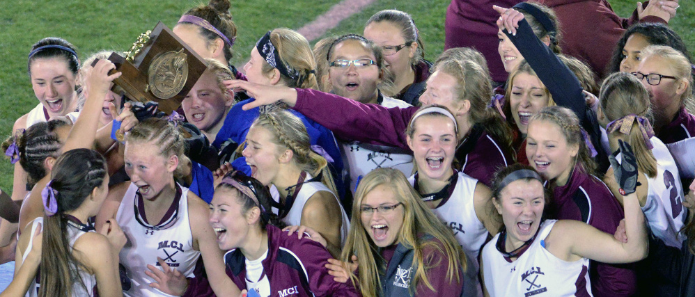 Maine Central Institute celebrates their 3-0 win over Oak Hill High School for the Class C state championship Saturday at Morse Field at University of Maine in Orono. It was the Huskies’ first state title.