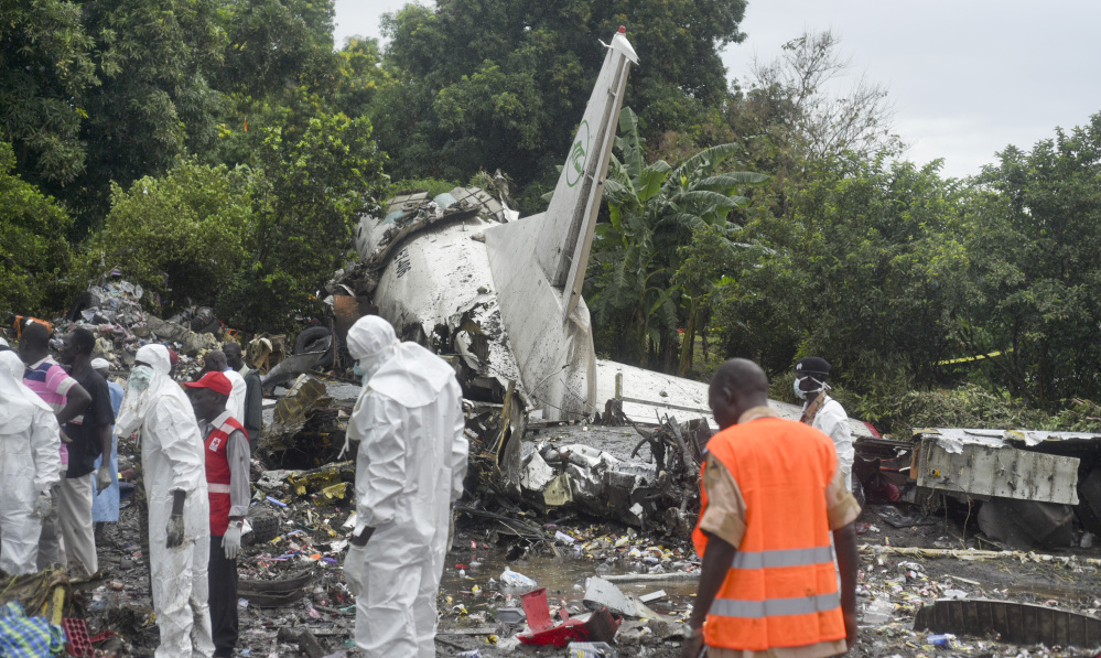 Responders pick through the wreckage of a cargo plane which crashed in the capital Juba, South Sudan Wednesday.