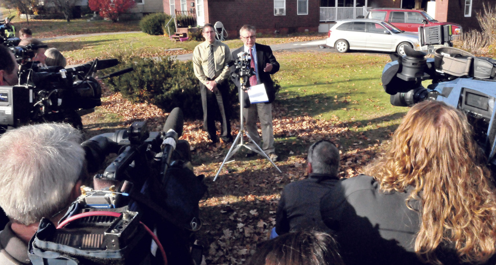 Oakland Police Chief Mike Tracy, left, and Steve McCausland, Department of Public Safety spokesman, talk to the press Thursday at the scene of Oakland’s multiple fatal shooting. One of the victims, Michael Muzzerole, was Tracy’s nephew.