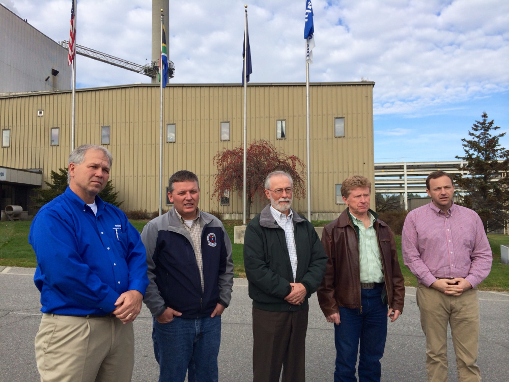 Tony Ouellette, managing director of the Sappi Somerset Mill, far left, stands with state legislators, from left to right, Maine Senate President Michael Thibodeau, Sen. Rod Whittemore, Sen. Bill Diamond and Maine House Speaker Mark Eves at the mill in Skowhegan on Thursday.