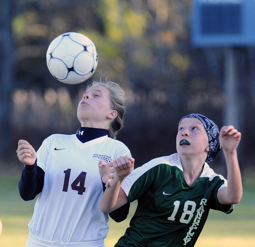 Richmond’s Caitlin Kendrick, left, heads the ball in front of Rangeley’s Brooke Egan during the Class D South final Wednesday in Richmond.