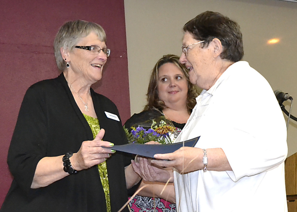 Mary O’Donal, right, receives special recognition from the Franklin County Chamber of Commerce for 55 years of service at Franklin Memorial Hospital. From left are Franklin County Chamber board members Shannon Smith and Jodi Cordes.