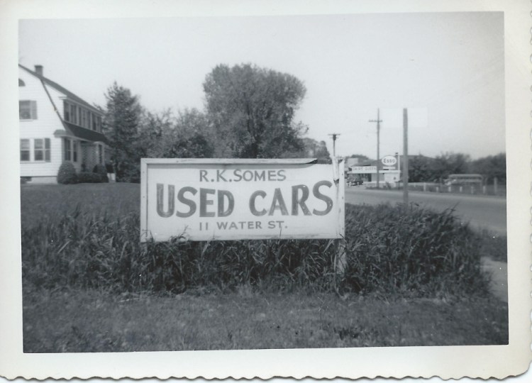 The business sign advertising cars for sale at Somes Used Cars on Water Street on the Hallowell-Augusta line.