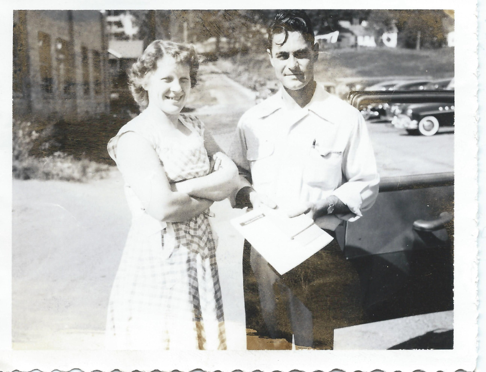 Elizabeth Somes and Robert K. Somes Sr. in front of their Water Street business on the Hallowell-Augusta line.