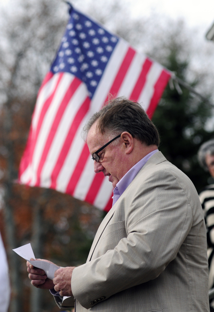 Tim Morgan reads a poem by Civil War soldier Charles Searles during the dedication of a new flagpole in Searles’ honor Saturday at the Chelsea Grange hall.