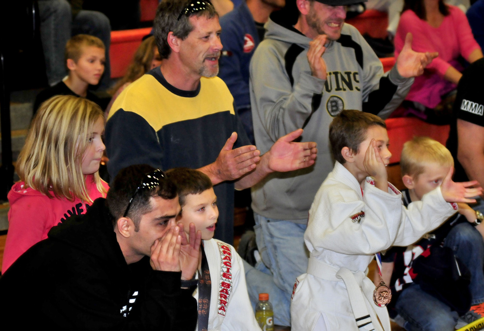 Fans cheer on team members during Maine Skirmish event Sunday in Winslow.