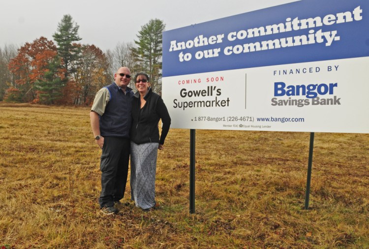 Rick and Bobbi Gowell on Thursday stand in a field where the new Gowell’s Supermarket will open next year in Litchfield.