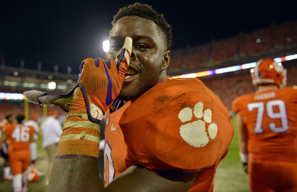 Clemson’s Shaq Lawson celebrates in the closing minutes after their 23-17 win over Florida State on Saturday in Clemson,  S.C.