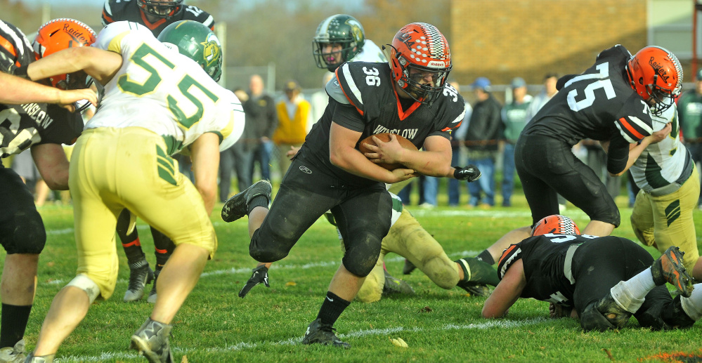 Winslow running back Kenny Rickard (36) runs the ball in for a touchdown during a Big Ten Conference semifinal Saturday against Mt. Desert Island at Poulin Field in Winslow. The Raiders rolled to a 21-0 victory and will travel to Old Town on Friday for the BTC championship game.