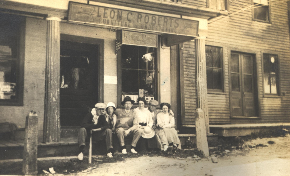 In this newly discovered circa 1920 photo are several Readfield residents sitting in front of Leon Roberts Furniture and Undertaker Store at Readfield Corner. Roberts’ store was located on the first floor of the original Masonic Block and was one of businesses destroyed in the fire of 1921. After the fire Roberts moved his store and funeral home business to Winthrop.