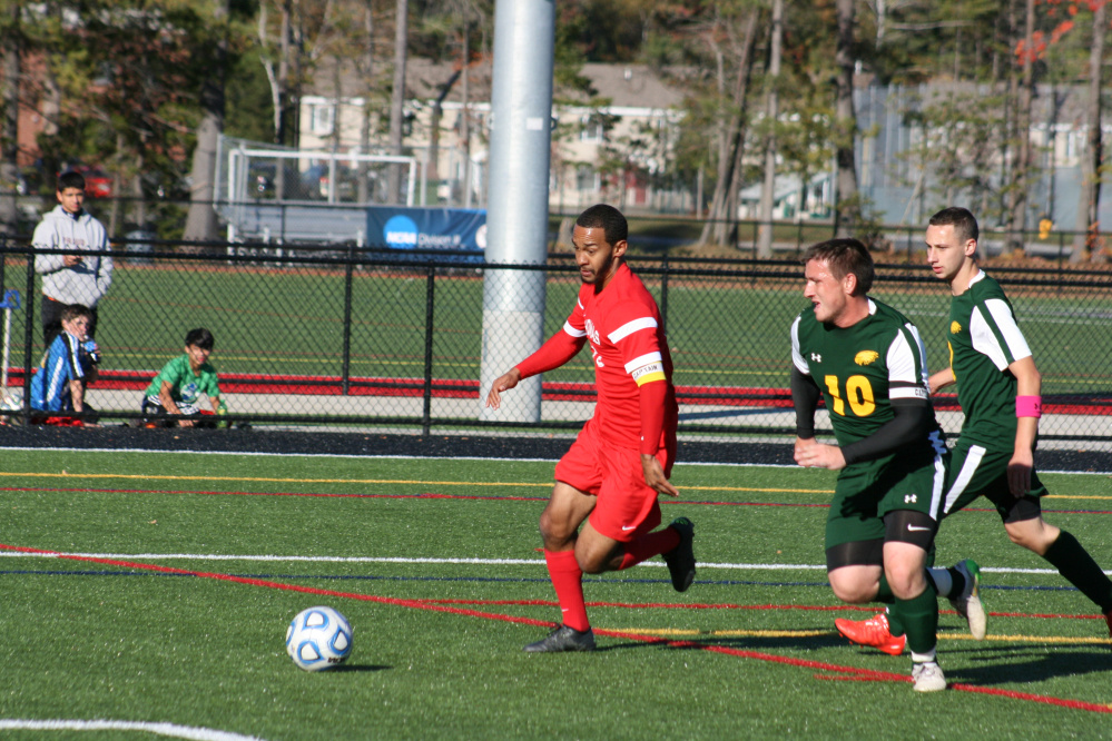 Thomas College’s Tre Ming (center) dribbles the ball up the field in a game played earlier this season in Waterville. Ming, the North Atlantic Conference men’s soccer Player of the Year, and the Terriers take on Brandeis in the opening round of the NCAA Division III tournament Saturday in Waltham, Massachusetts.