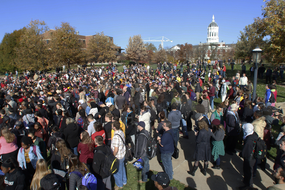Members of Concerned Student 1950, University of Missouri’s Graduate Professional Council, faculty and student supporters gather at Mel Carnahan Quadrangle to rally in support of an ongoing protest to get UM System President Tim Wolfe to resign on Monday.