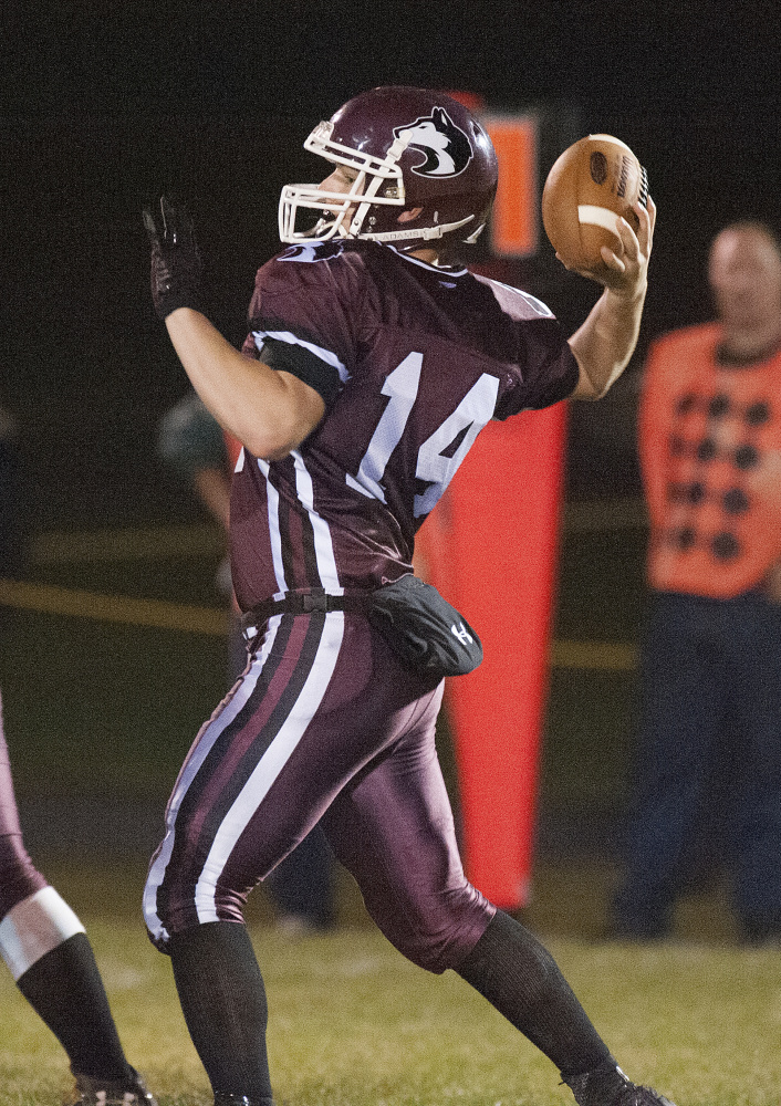 Kevin Bennett file photo
MCI quarterback Greg Vigue looks to pass during the Little Ten Conference championship game last Friday night against Orono.