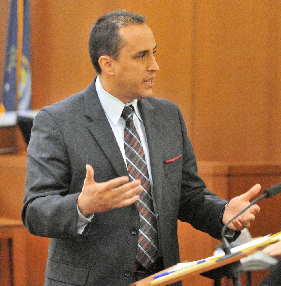 Defense attorney Darrick Banda speaks to the jury during opening statements in the Capital Judicial Center on Thursday in the trial jury trial of Roland L. Cummings, accused of murdering 92-year-old Aurele Fecteau in May 2014 in Fecteau’s Waterville home.
