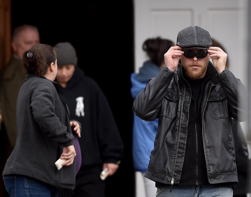 Friends and family of sisters Amanda Bragg and Amy DeRosby, killed in last week’s murder-suicide, leave a memorial at Lighthouse Ministry Center in Oakland on Saturday.