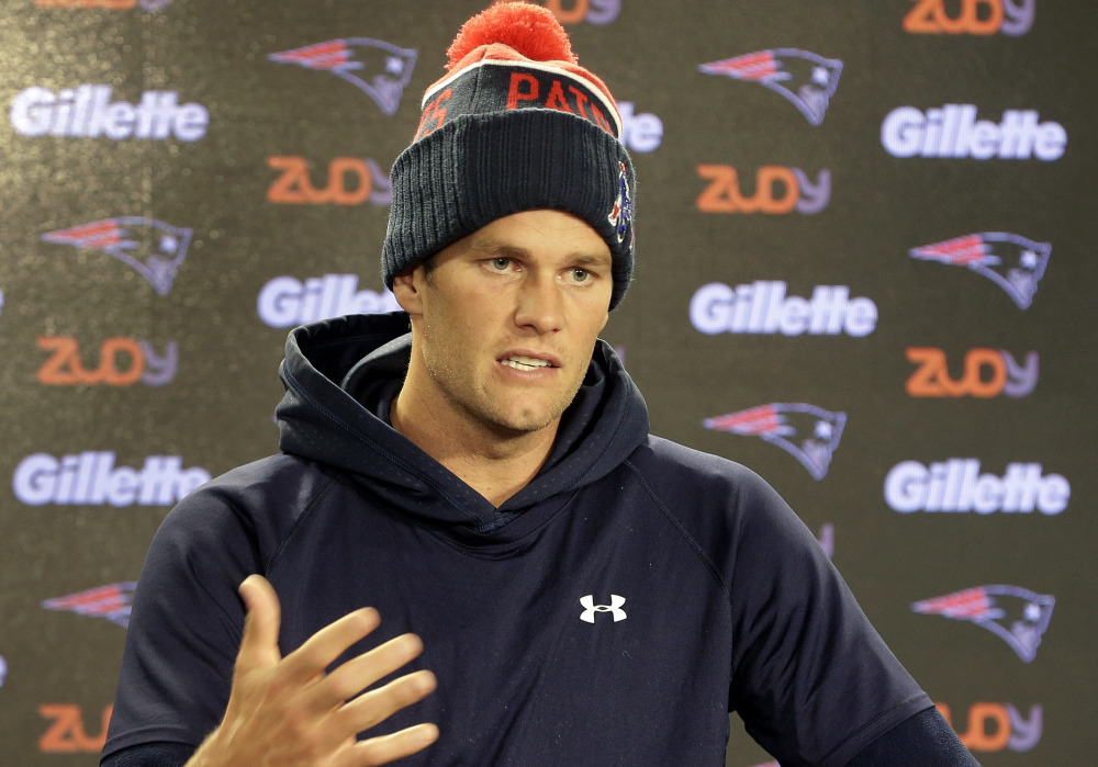 New England Patriots quarterback Tom Brady faces reporters during a news conference before an NFL football practice on Wednesday in Foxborough, Mass. The Patriots are to play the New York Giants in East Rutherford, N.J., on Sunday.