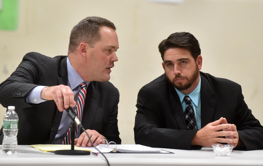 Gregg Frame, left, confers with his client, Waterville Senior High School Principal Don Reiter, on Wednesday night at Reiter’s dismissal hearing. Waterville police said Sunday they have received communications from former students of Reiters in New Hampshire alleging the same type of behavior — propositioning a student — that he is accused of in Waterville.