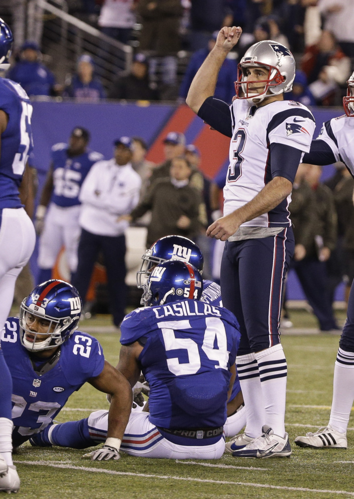 New England’s Stephen Gostkowski (3) celebrates after kicking the winning field goal with 1 second remaining in the game as New York Giants’ Rashad Jennings (23) and Jonathan Casillas (54) react Sunday in East Rutherford, N.J. The Patriots won 27-26.