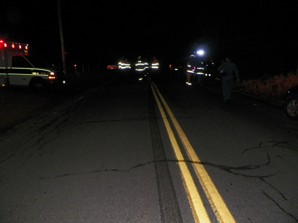 Emergency responders converge on Ferry Street in Solon Friday night, where Joshua Sincyr of Norridgewock was killed when he was hit by a pickup truck driven by Seth Burns of Embden.