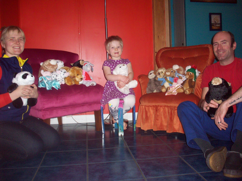 The Ziemer family, from left, Ariel, Gudran and Morgan, with stuffed animals that were donated the first two days of the campaign.