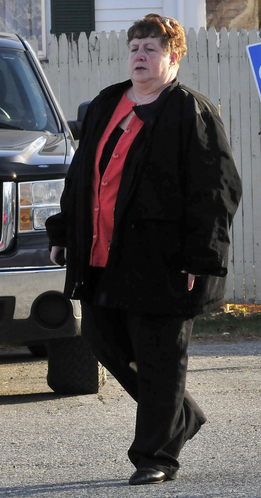 Former district attorney office secretary Julie Smith leaves Somerset Superior Court in Skowhegan Wedmesday following a hearing on charges of embezzling funds and tampering with public records.