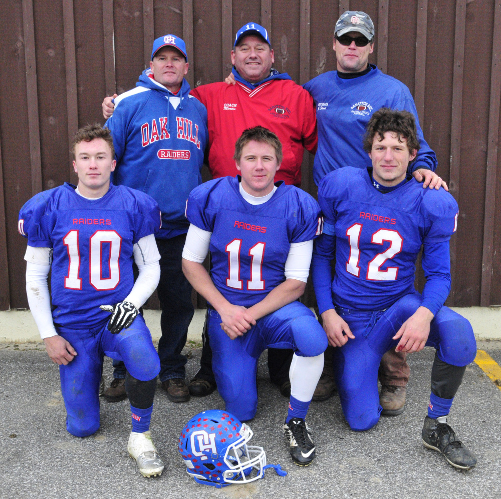 Members of the Oak Hill 1982 Class D state championship team — Don Therrien, Billy Martin and Gordon Strout — pose with their sons,
Dalton Therrien, left, Jonah Martin and Matthew Strout last Saturday in Wales.