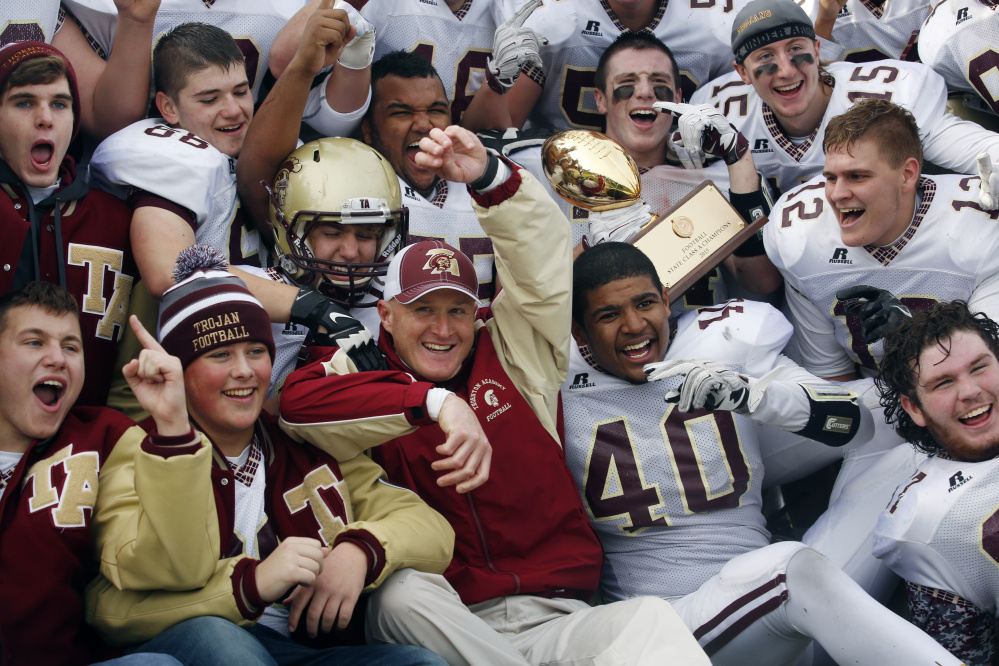 Coack Kevin Kezal and the Thornton Academy football players have that golden glow Saturday after winning the Class A championship for the third time in four seasons with a 24-14 victory against Portland at Fitzpatrick Stadium.