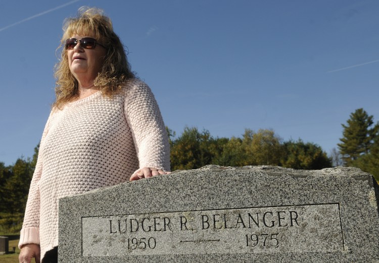 Linda Perkins at the gravestone of her first husband, Ludger Belanger, in Somerville in October. Belanger, 25, went hunting 40 years ago and never returned. He was formally declared dead in 2001. Belanger is listed as an unsolved homicide in the Maine State Police files.