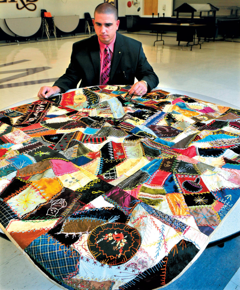 Staff file photo
Waterville Senior High School principal Don Reiter in 2010 displays a quilt that had been made for the Class of 1886. Reiter was considered a charismatic and engaged leader of the school, where he’d been principal since 2007.