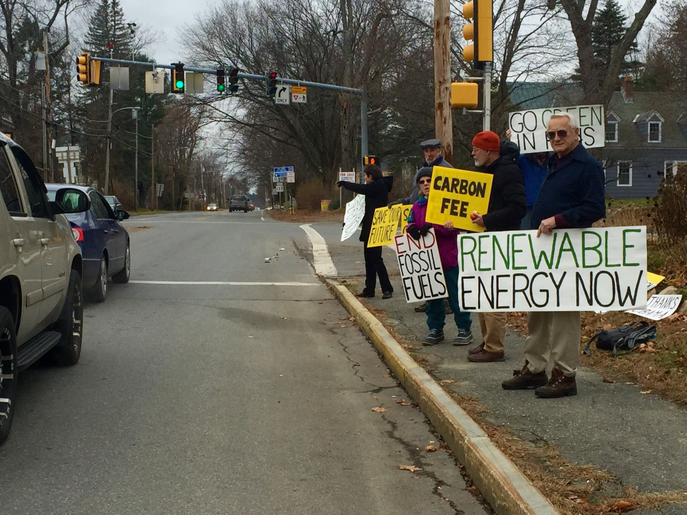 Members of 350 Central Maine demonstrate on the side of Silver Street in Waterville in front of the Universalist Unitarian Church to promote climate change awareness. From right to left: Beth Schiller, of Waterville; Iver Lofving, of Skowhegan; Linda Woods, of Waterville; Richard Thomas, of Waterville; and Irving Gilbert, of Waterville.