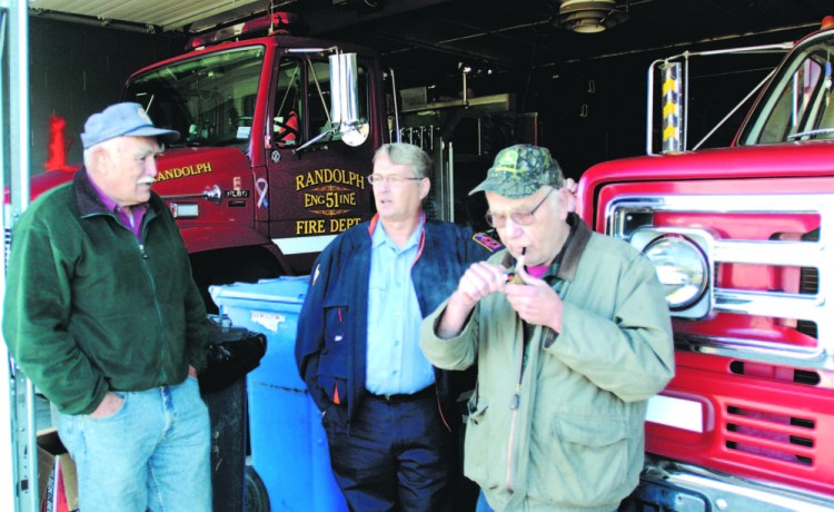 Lewis “Duddy” Brown, left, Ron Cunningham and Andy Cooper chat in the bay of the Randolph Fire station in this 2007 file photo. Brown died Monday night after being hit by a car outside his home.