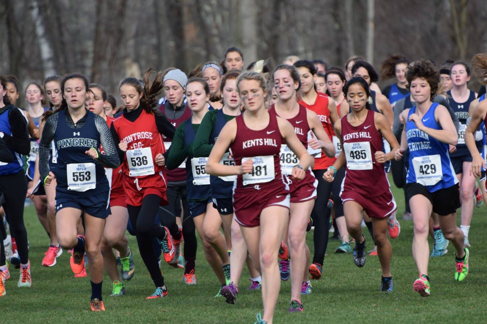 Anne McKee, of Kents Hill, leads a pack of runners during the New England Prep School Division 4 championship race in South Kent, Connecticut recently. McKee won the race for her third consecutive prep school title.