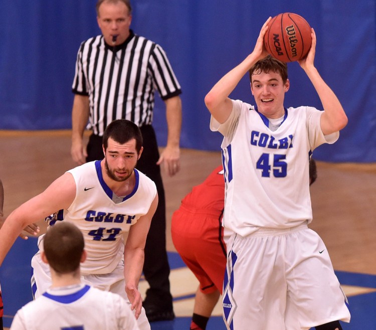 Colby College’s Patrick Stewart (45) looks for the outlet pass after grabbing a rebound during a non-conference game against Thomas College on Tuesday night in Waterville.