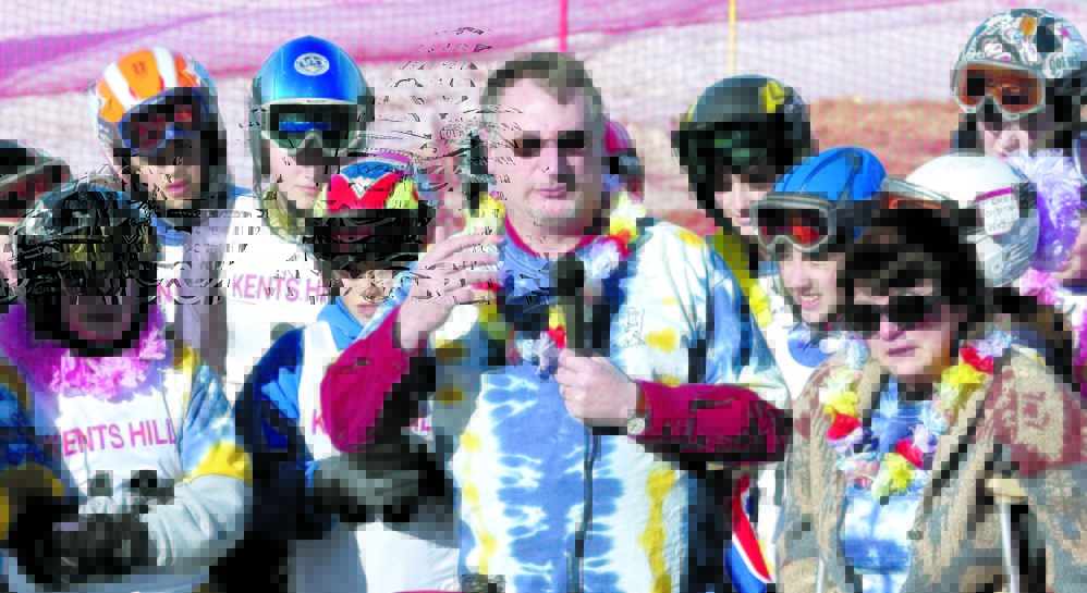Surrounded by middle school skiers wearing tie-dyed T-shirts and leis, Ted Johnston and Marlene Thibodeau speak to the crowd before the Marlee Johnston Memorial Slamom Race in this 2006 file photo at Kents Hill School in Readfield.