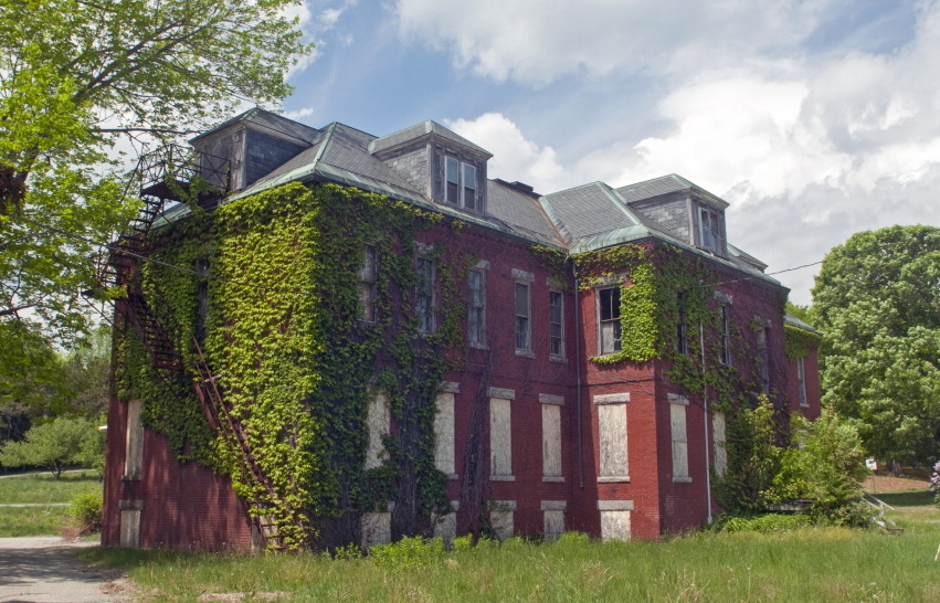 Buildings at the Stevens School complex in Hallowell, which is for sale, have been boarded up for years.