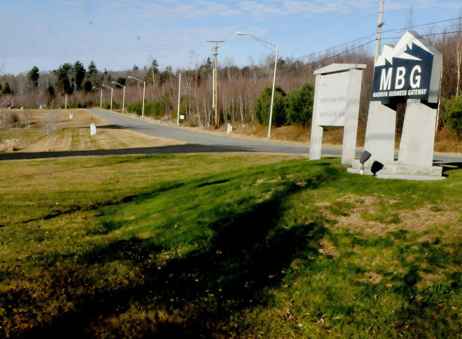 The entrance to the Madison Business Gateway park shows where a proposed 4-megawatt solar farm could be built in the wooded area on the right.  