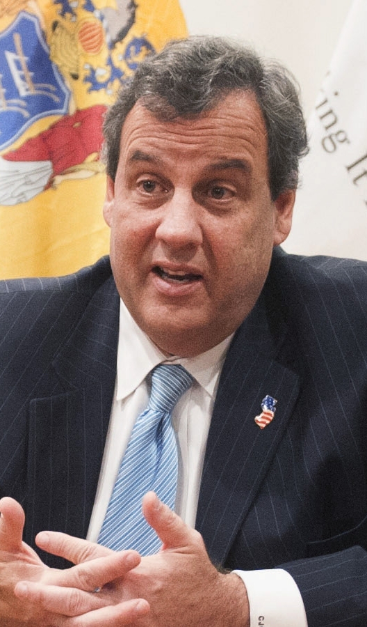 Chris Christie, left, and Mike Huckabee were bumped from the main stage at next week’s debate.
