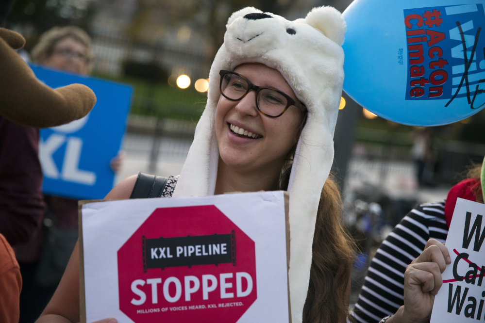 Taran Catania of Washington smiles during a gathering in front of the White House on Friday to celebrate President Obama’s rejection of the Keystone XL pipeline.