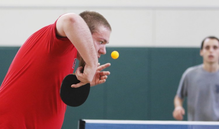 T.J. Braley of Lee sets up his serve to Sebastian Taylor during a match at the Maine State Championship Tournament for table tennis at Pineland Farms. Jill Brady/Staff Photographer