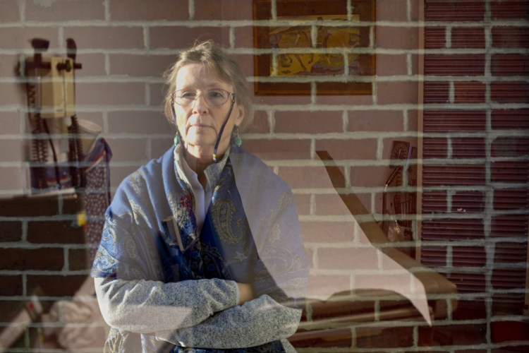 At the Milestone Foundation, primarily a short-term detox center, Dr. Mary Dowd tries to line up long-term treatment for addicts, but there are far more patients than available services. This double exposure shows her at the foundation, and in a patient exam room.
Gabe Souza/Staff Photographer